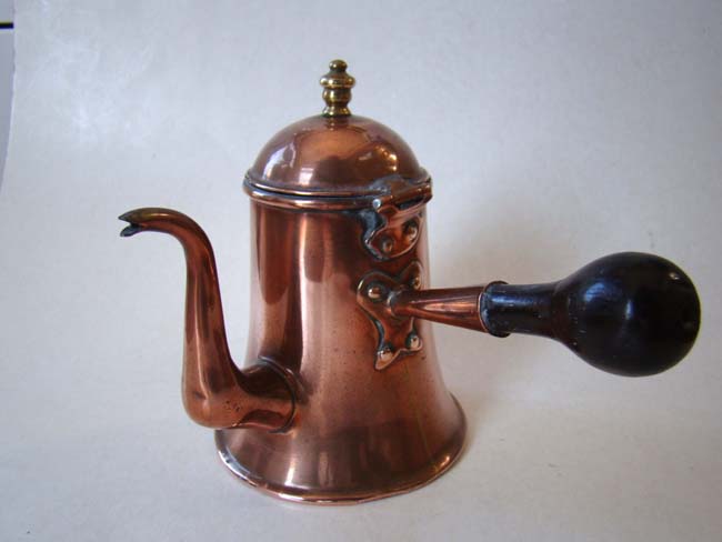 A charming 18th century copper chocolate pot with side-mounted ebony handle circa 1750